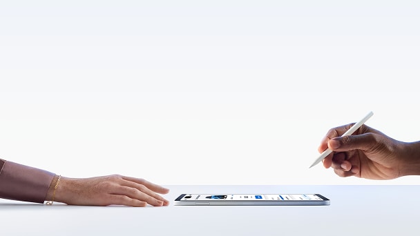 Woman’s hand preparing to interact with a Tablet